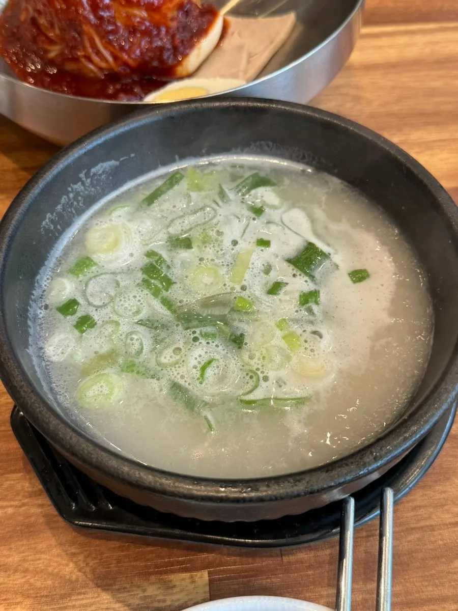 Suyuk baekban with boiled pork and broth served separately