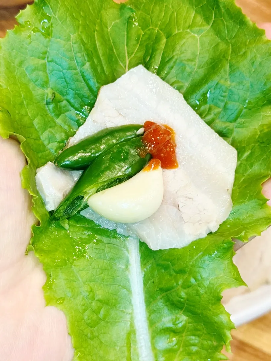 Boiled pork wrapped in lettuce and perilla leaf