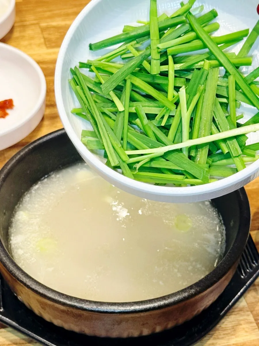 Warm soup with chives added