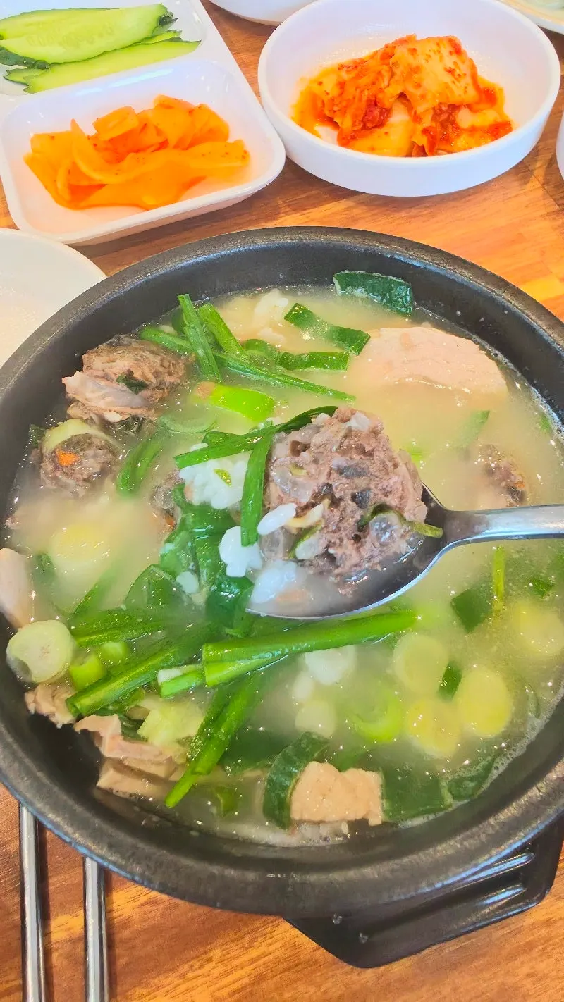 Vertical photo of a Busan Station restaurant serving both dwaeji gukbap and milmyeon