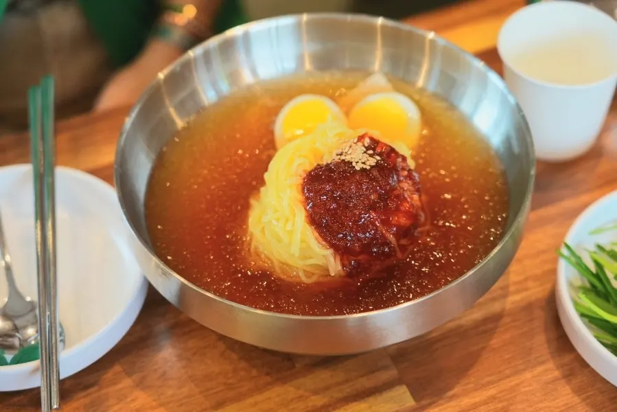 Chewy mul milmyeon noodles lifted up