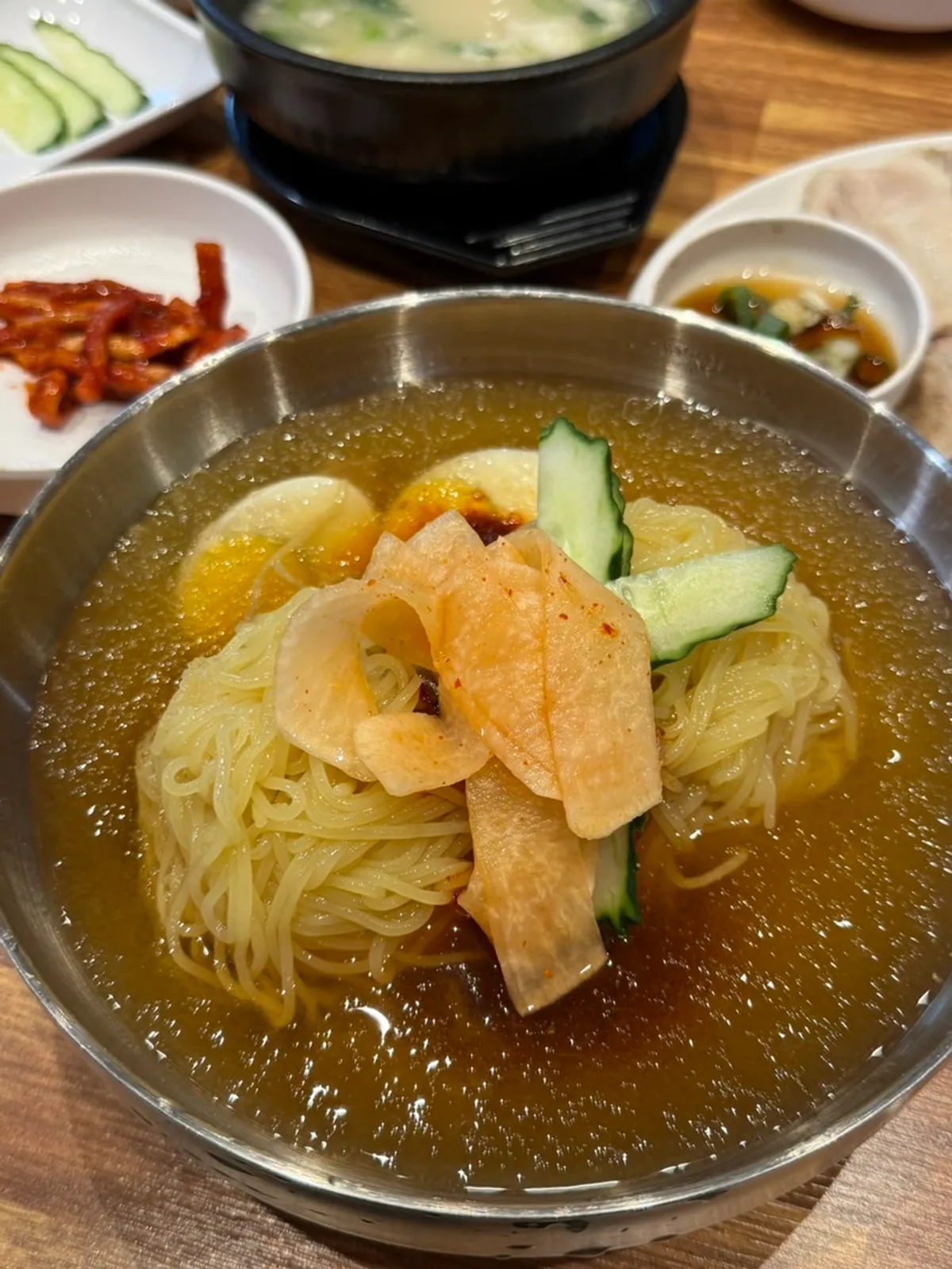 Table setting with milmyeon and suyuk baekban