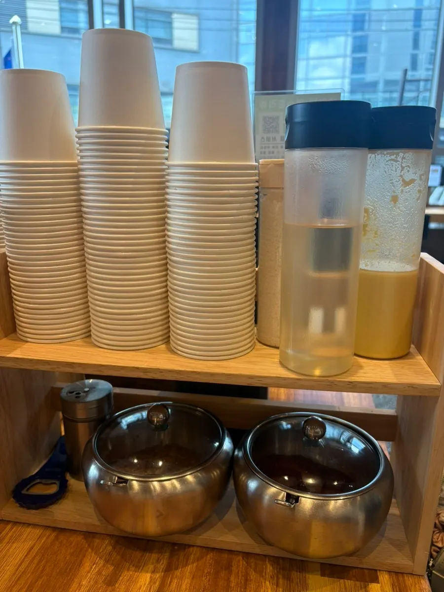 Hot broth served alongside the milmyeon