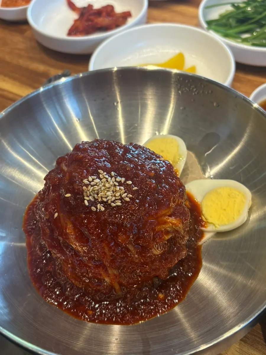 Table spread with bibim milmyeon and dumplings