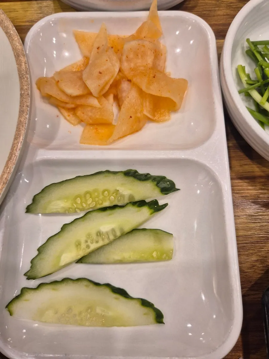 Radish kimchi and cucumber served separately
