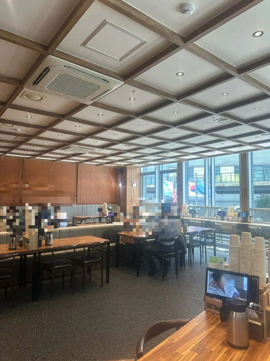 The spacious interior seating of Yeongdong Milmyeon & Dwaeji Gukbap Busan Station Branch