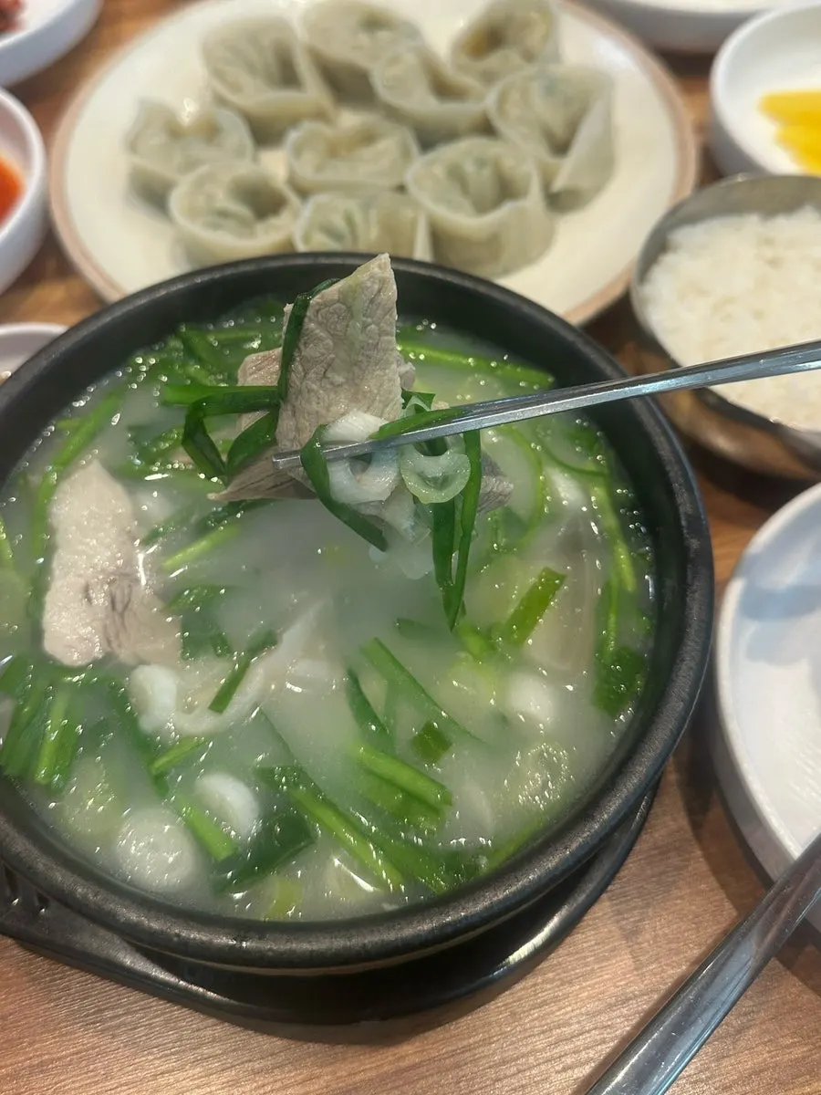 A bowl of dwaeji gukbap with rice mixed in