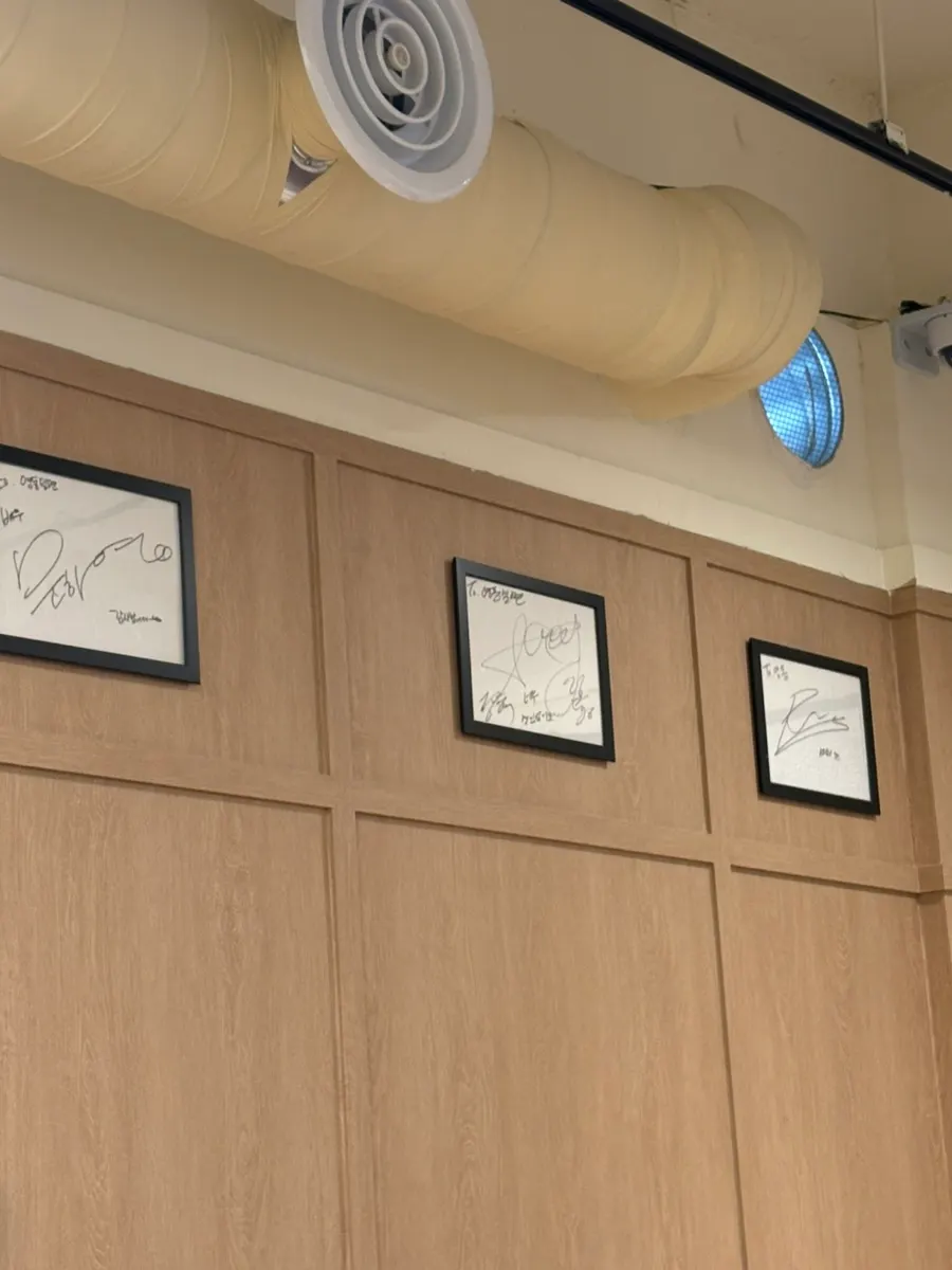 Restaurant wall covered in celebrity autographs
