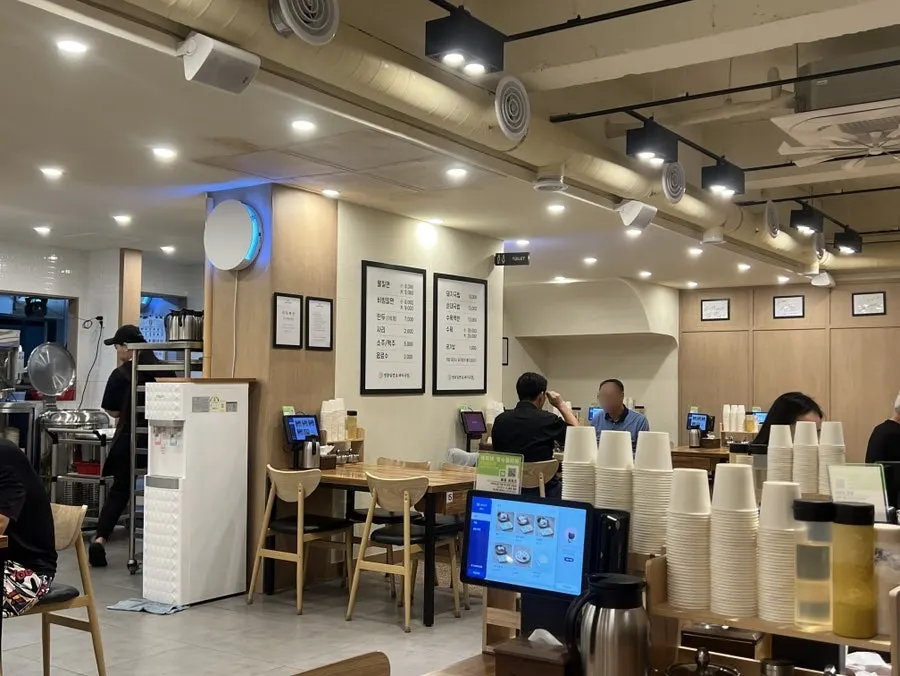 Inside the Yeongdong Milmyeon restaurant with weekday evening customers