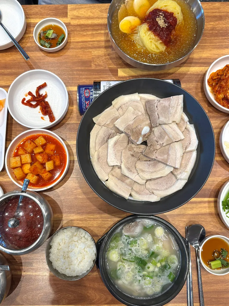 A two-person table with gukbap, suyuk, and mul milmyeon together