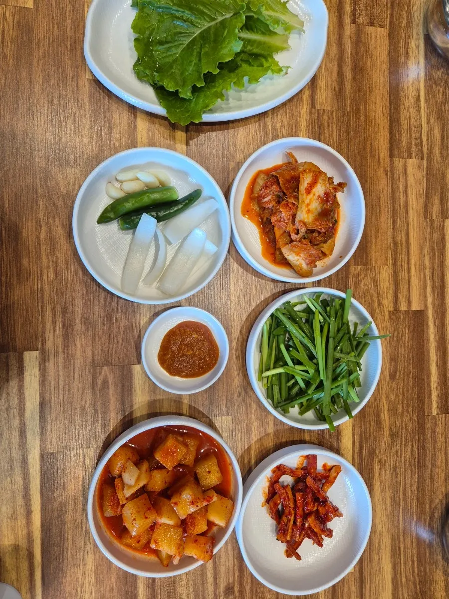 Eating gukbap and boiled pork together