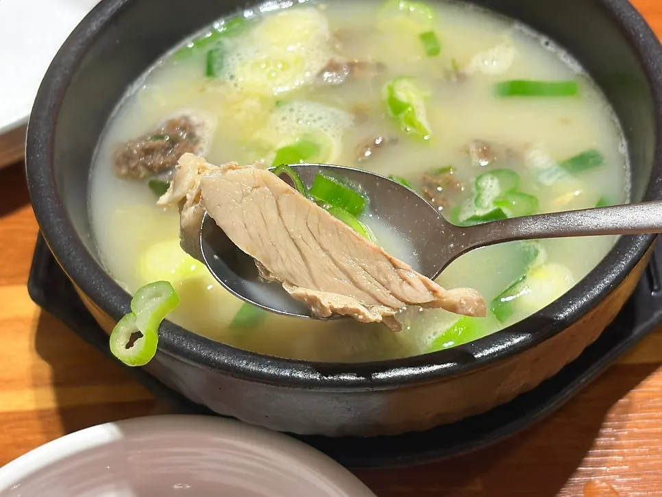 Inside of the sundae gukbap loaded with sundae and meat