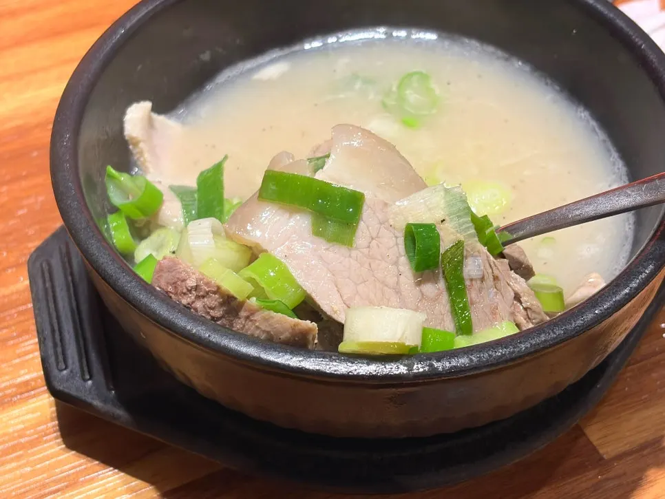 Dwaeji gukbap served in a stone bowl