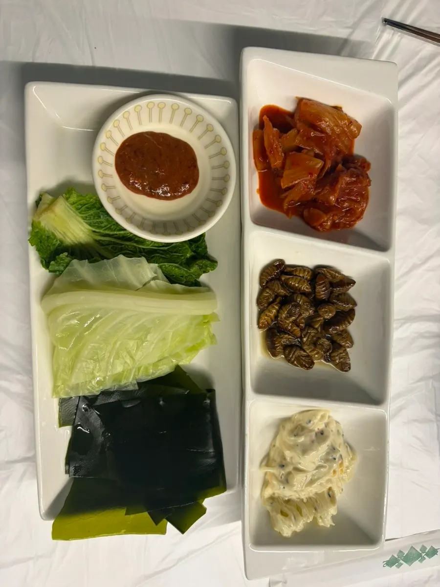 Base banchan spread with stir-fried kimchi and beondegi