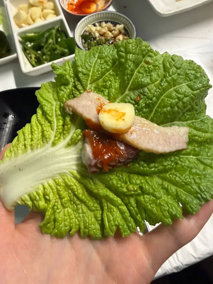 A plate with octopus legs and boiled pork together