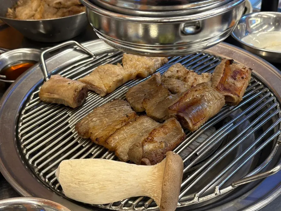 Seasoned ribs cooking on the grill