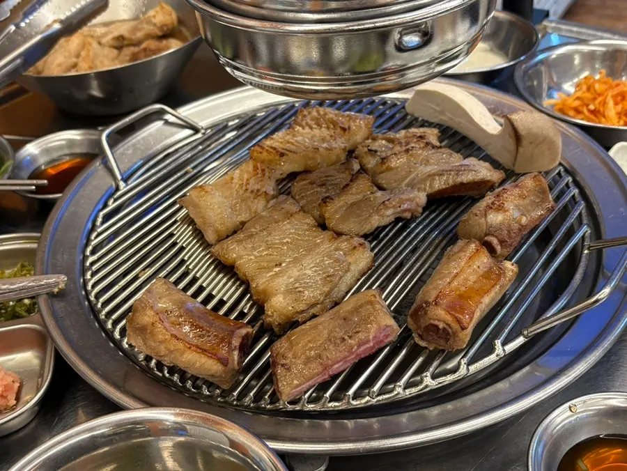 Pre-grilled pork ribs added one by one
