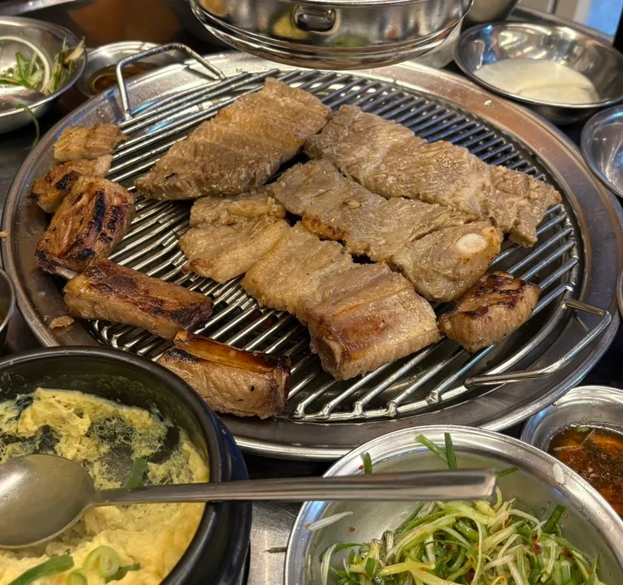 Table packed full of food, legs about to break
