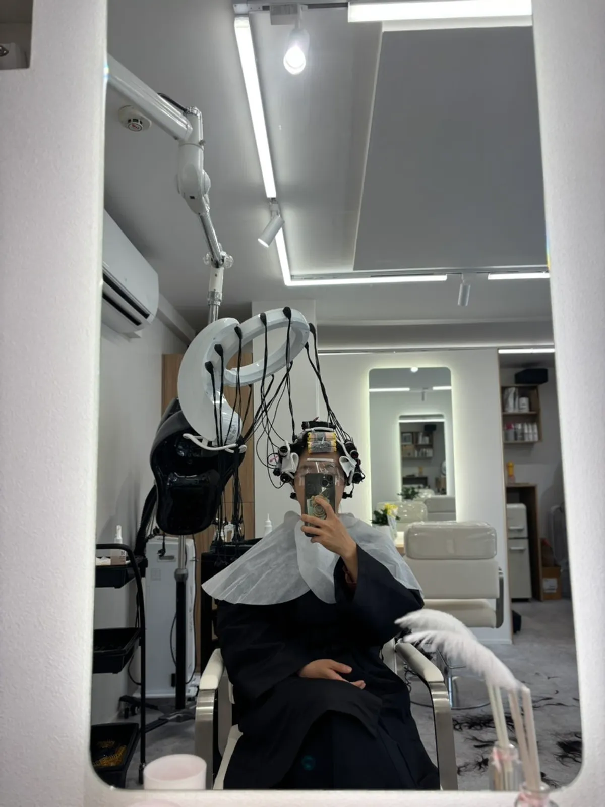 The owner shaping the hair during the treatment