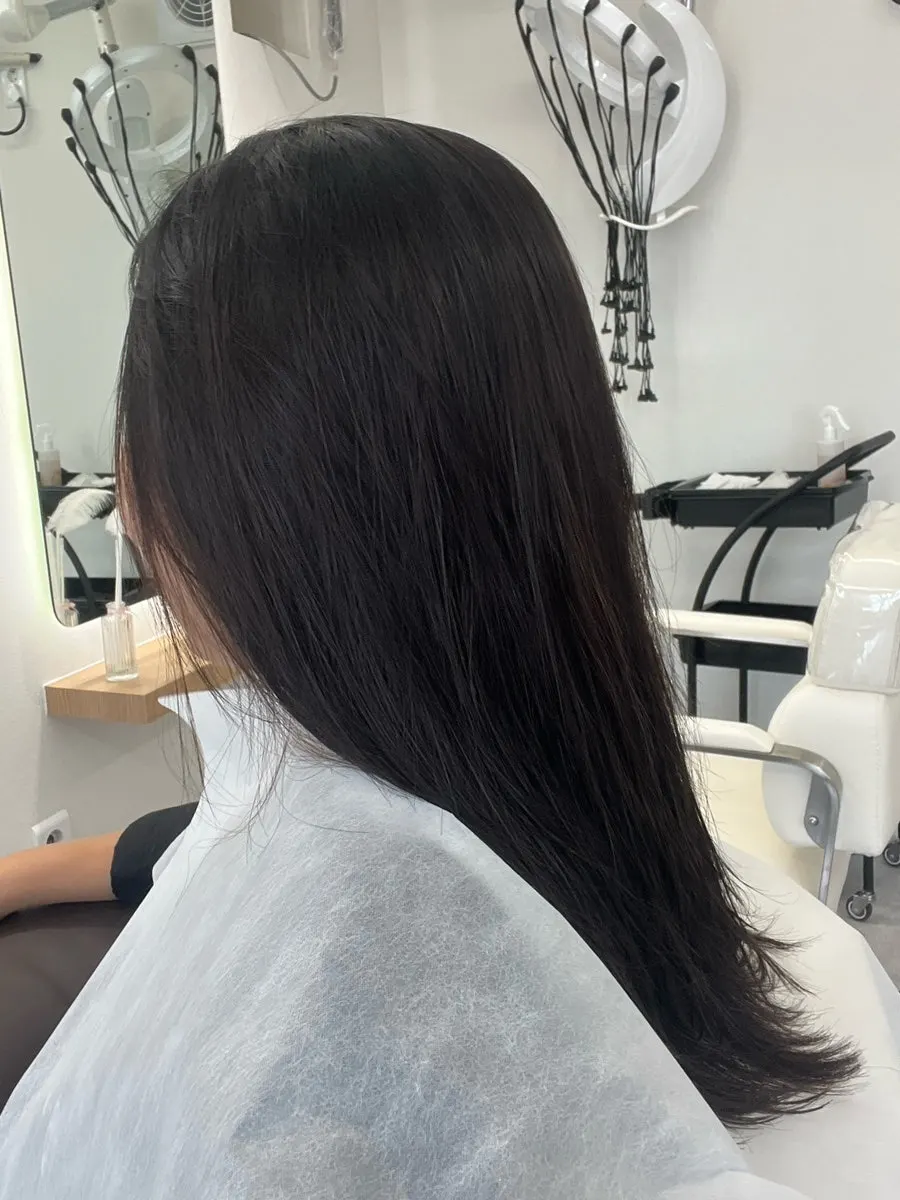 Mid-treatment check on hair during the perm