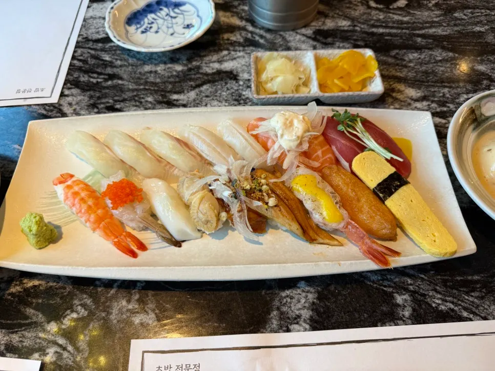 Flatfish, salmon, and eel sushi selection