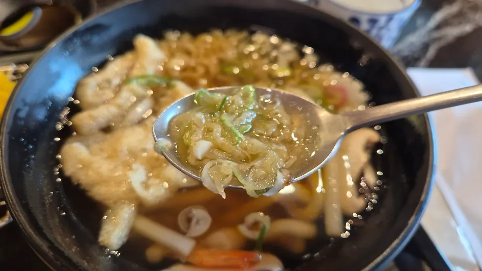 Warm udon served alongside the meal