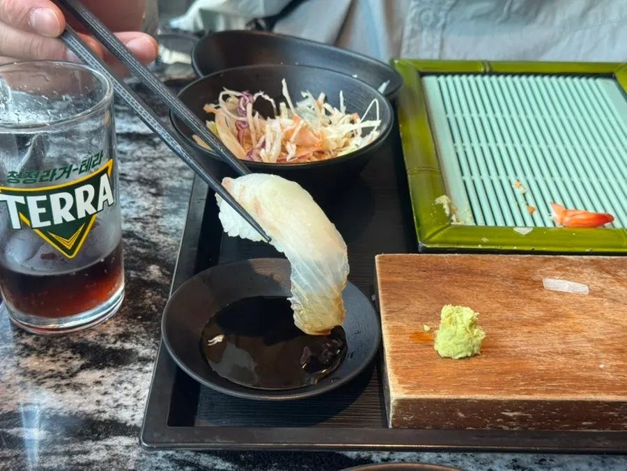 Sushi selection including flounder and salmon
