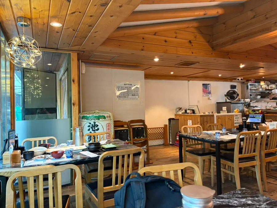 Wood-toned dining area at Moshi Moshi PNU Branch