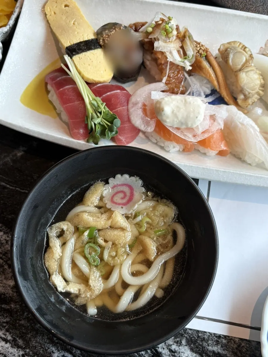 Table for two with sushi and sides together