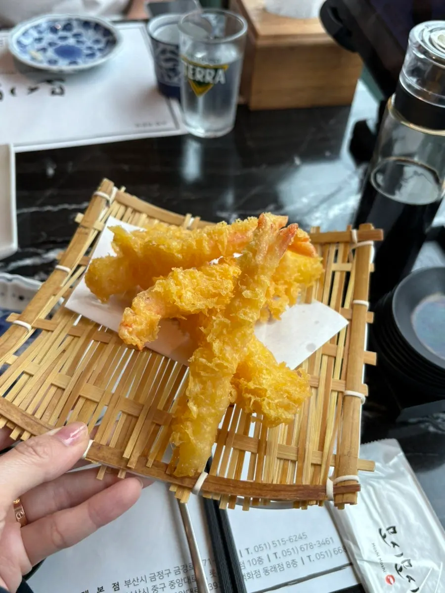 A moment of amazement at the sushi's taste