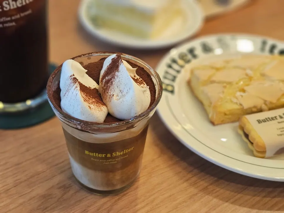 Table with americano and desserts together