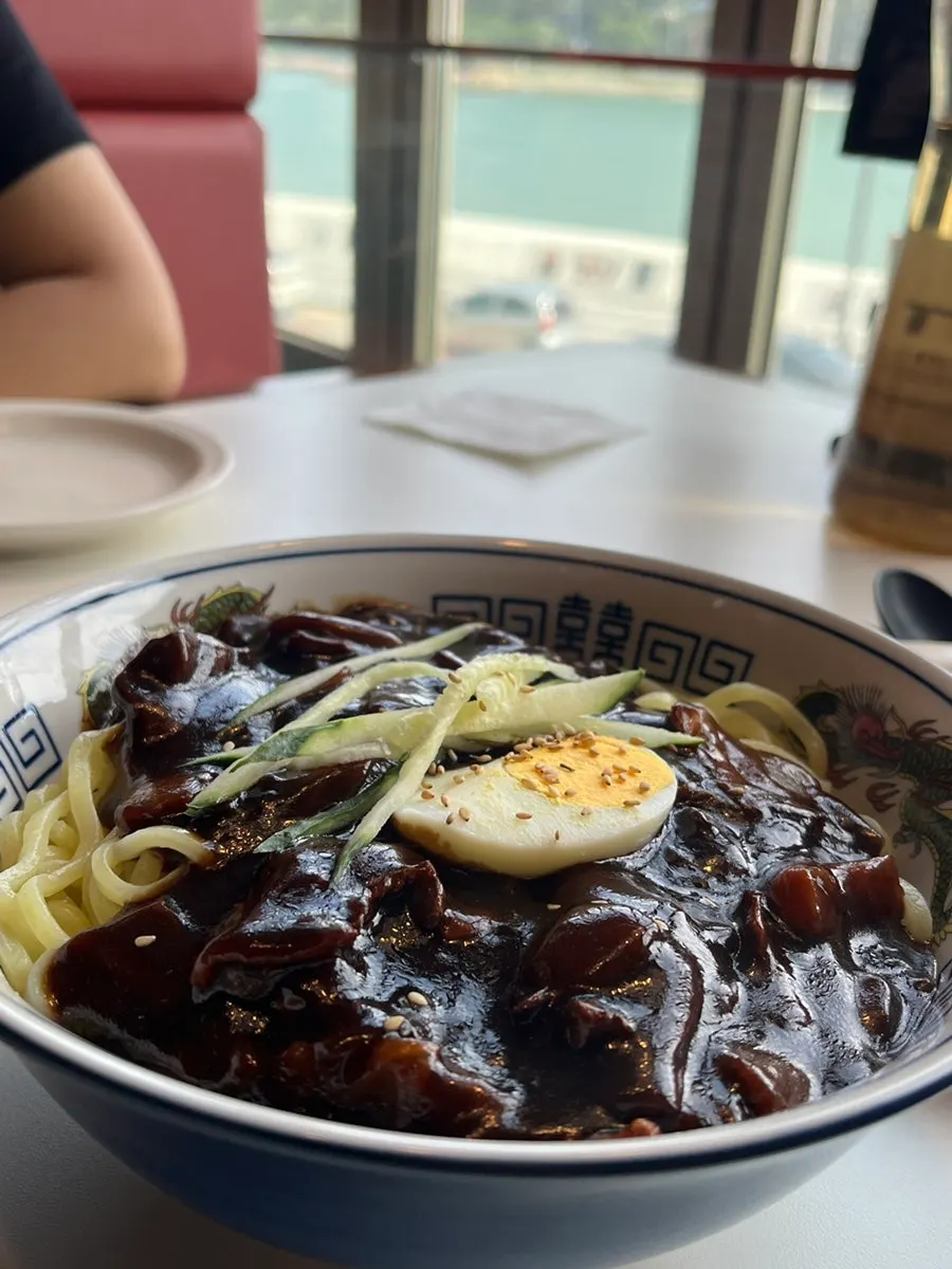 Large BUUK jjajangmyeon topped with half an egg