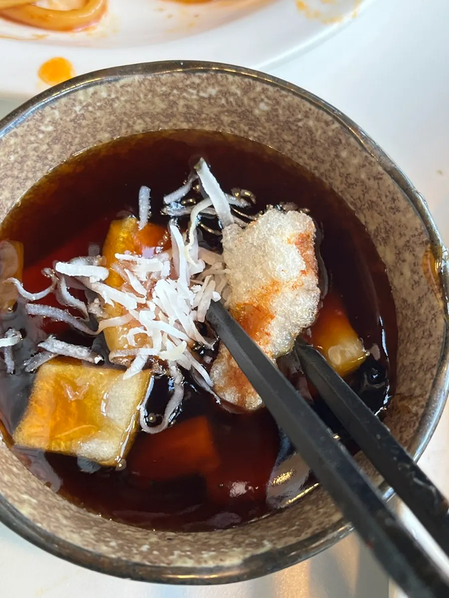 Fried tangsuyuk pieces dipped in extra sauce
