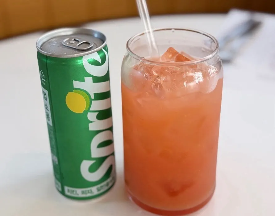 Single grapefruit, Sprite, and napa cabbage Caesar salad
