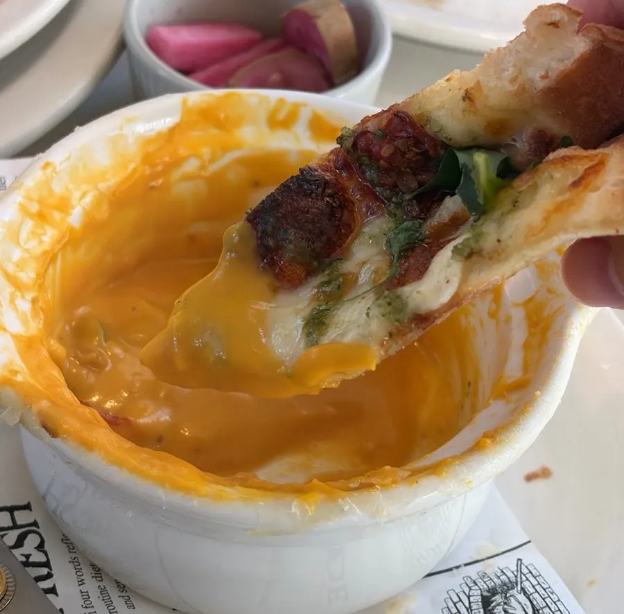 Eating pizza together with the pumpkin soup
