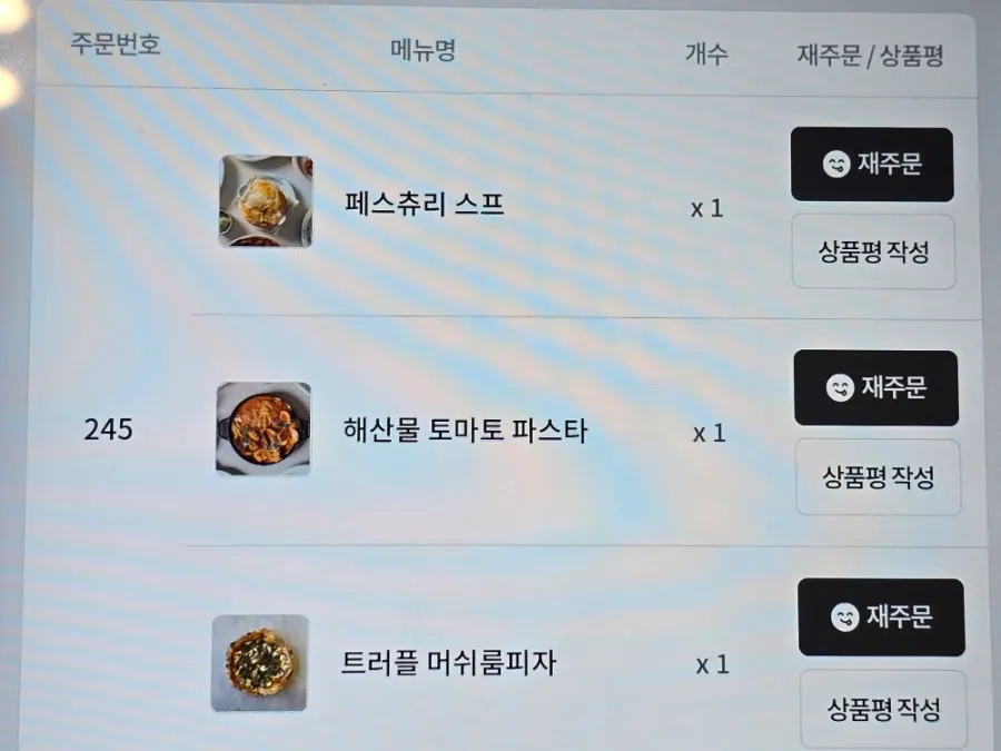 Pizza and pasta menu items selected on the tablet