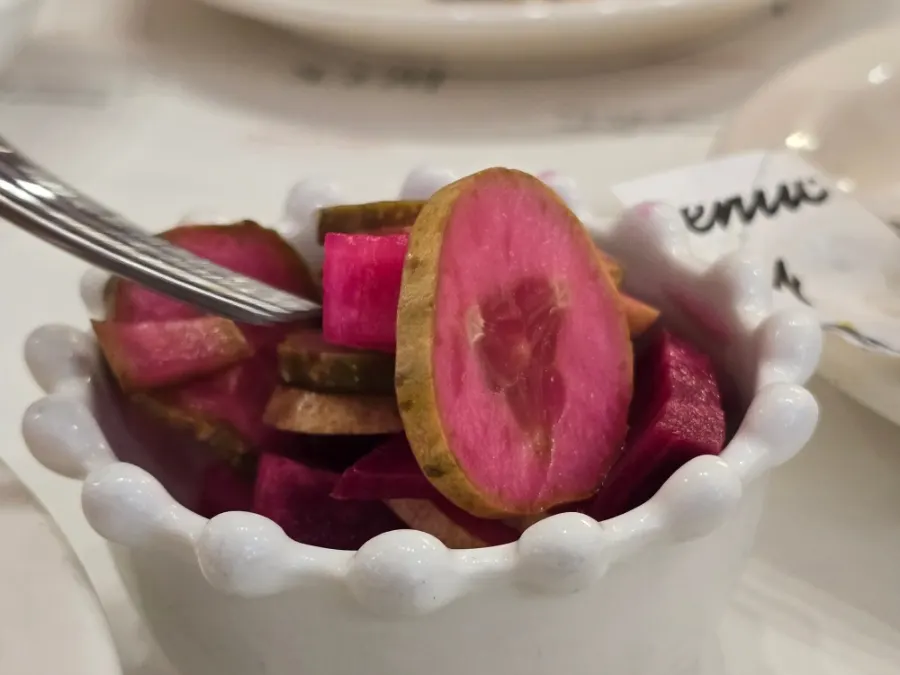 Plate of food with a reddish beet color