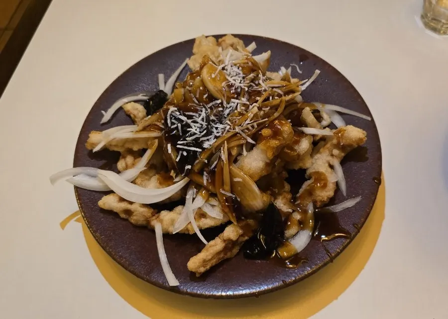 Black vinegar pork loin tangsuyuk topped with wood ear mushrooms and onions