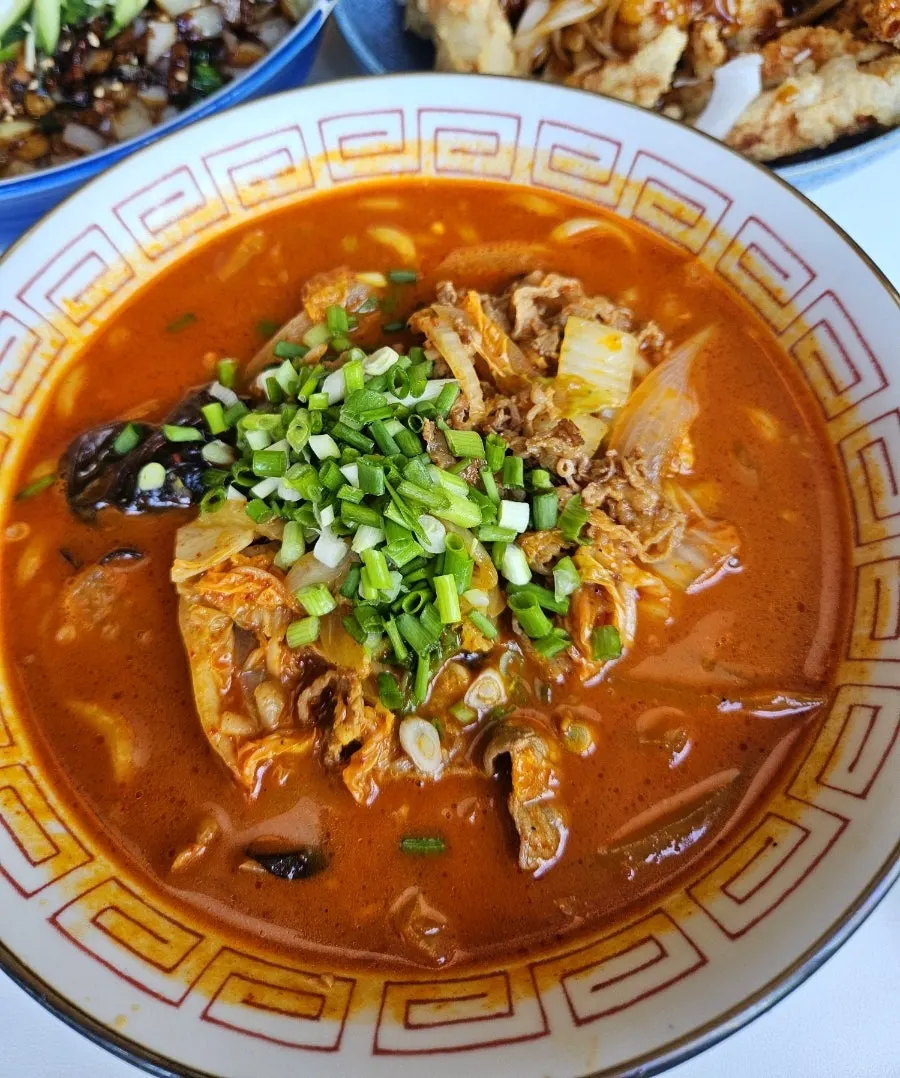Sooran-ganjajang topped with a soft poached egg and julienned cucumber