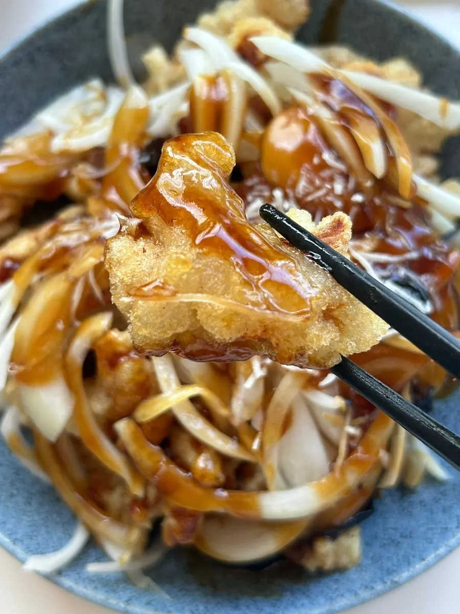 A piece of sirloin pork coated in sauce