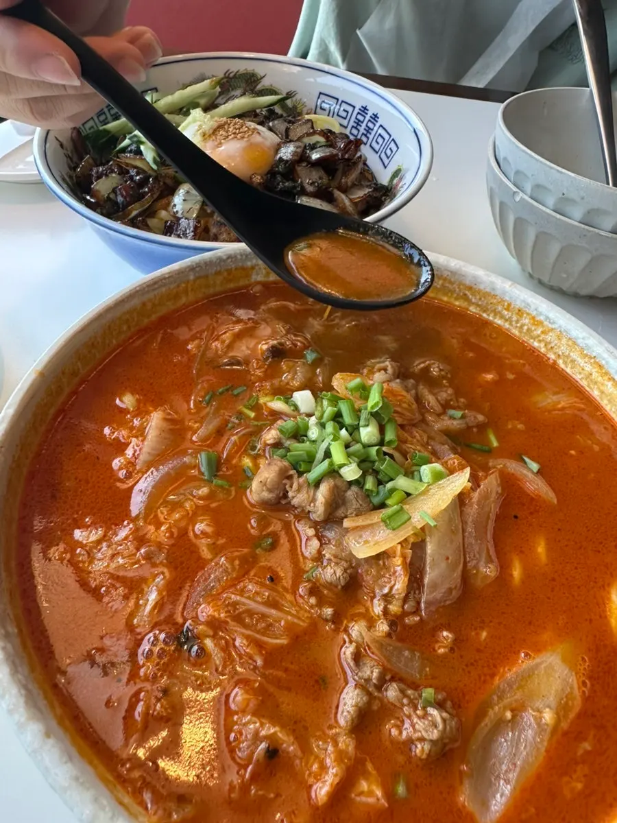 A bowl of jjamppong loaded with beef brisket