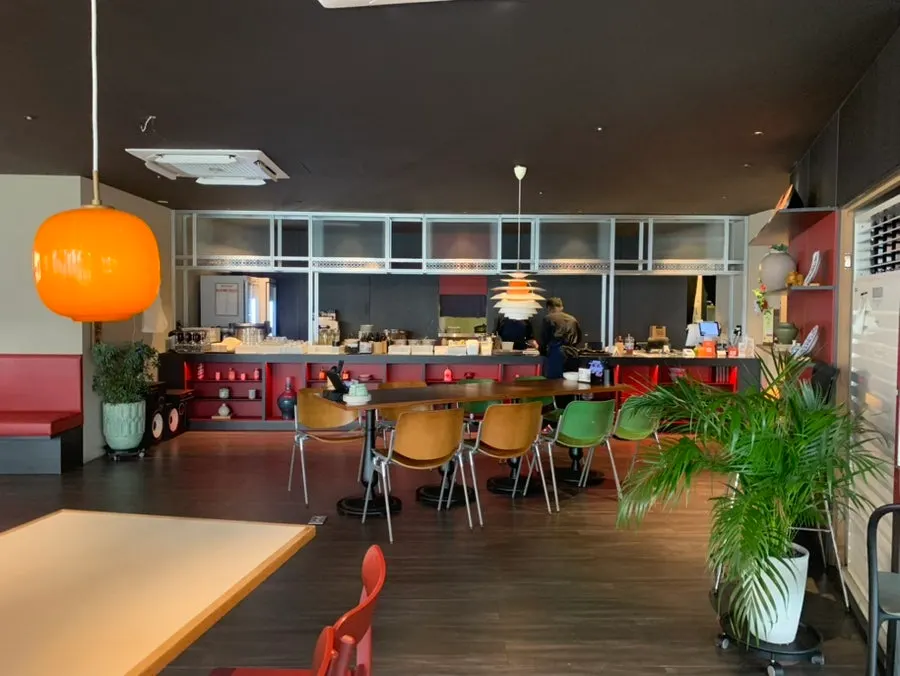 Spacious restaurant interior with generously spaced tables