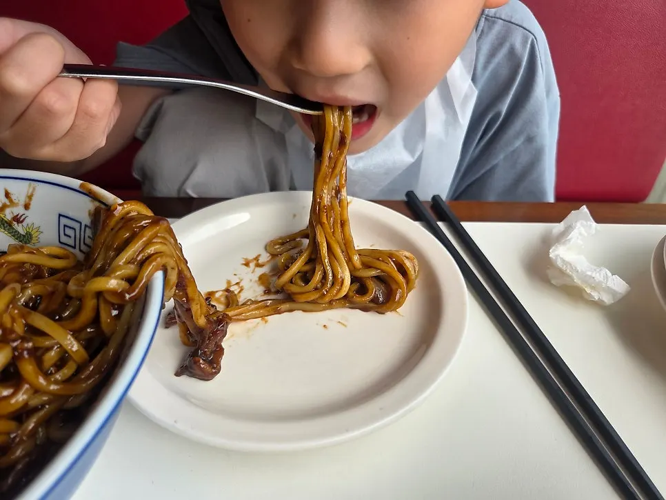 My son starting on his jjajangmyeon