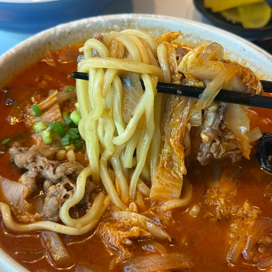 Jjamppong noodles lifted from the bowl