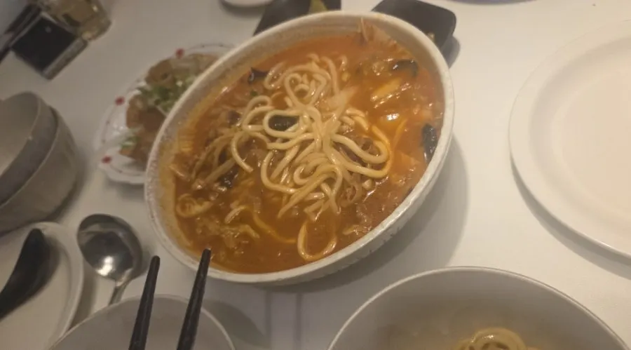 A bowl of spicy jjamppong broth