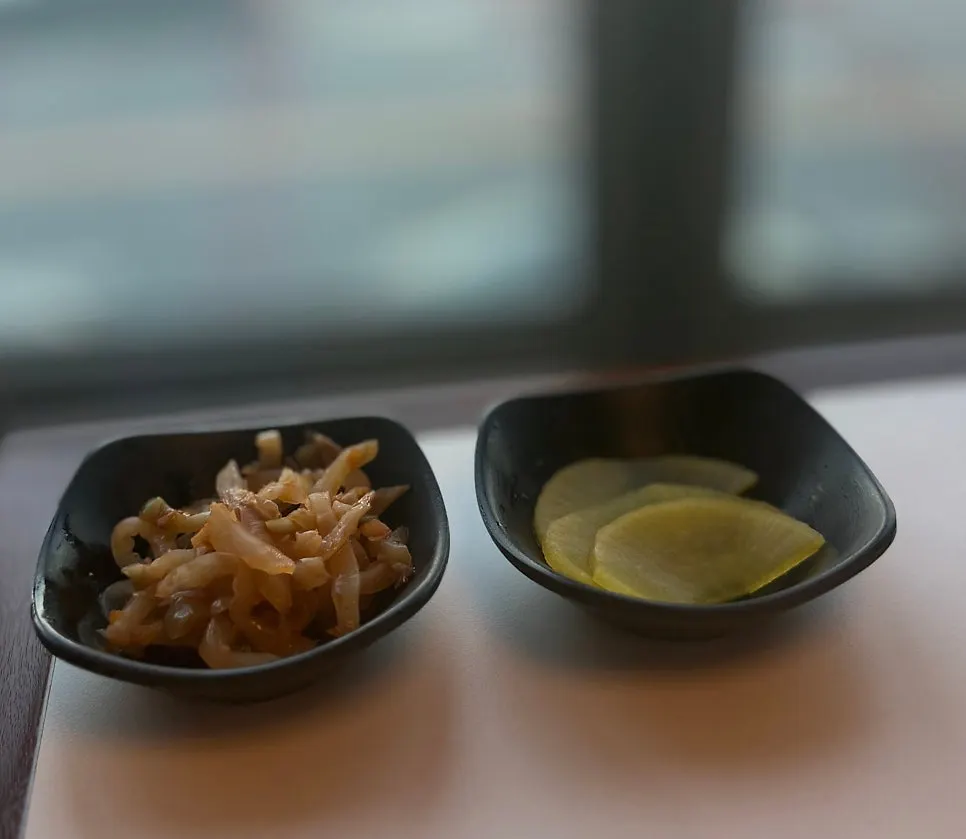 Basic table setting with pickled radish and jjachai