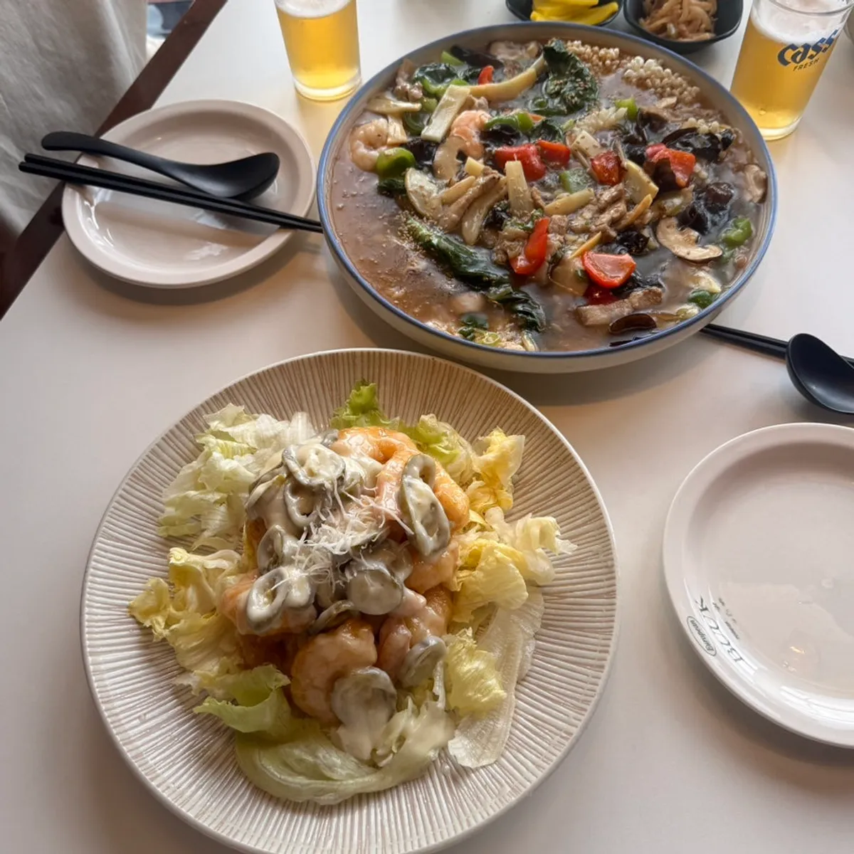 Table setting of seafood nurungji soup and cream shrimp at Bueokgan Chinese, Marine City, Haeundae