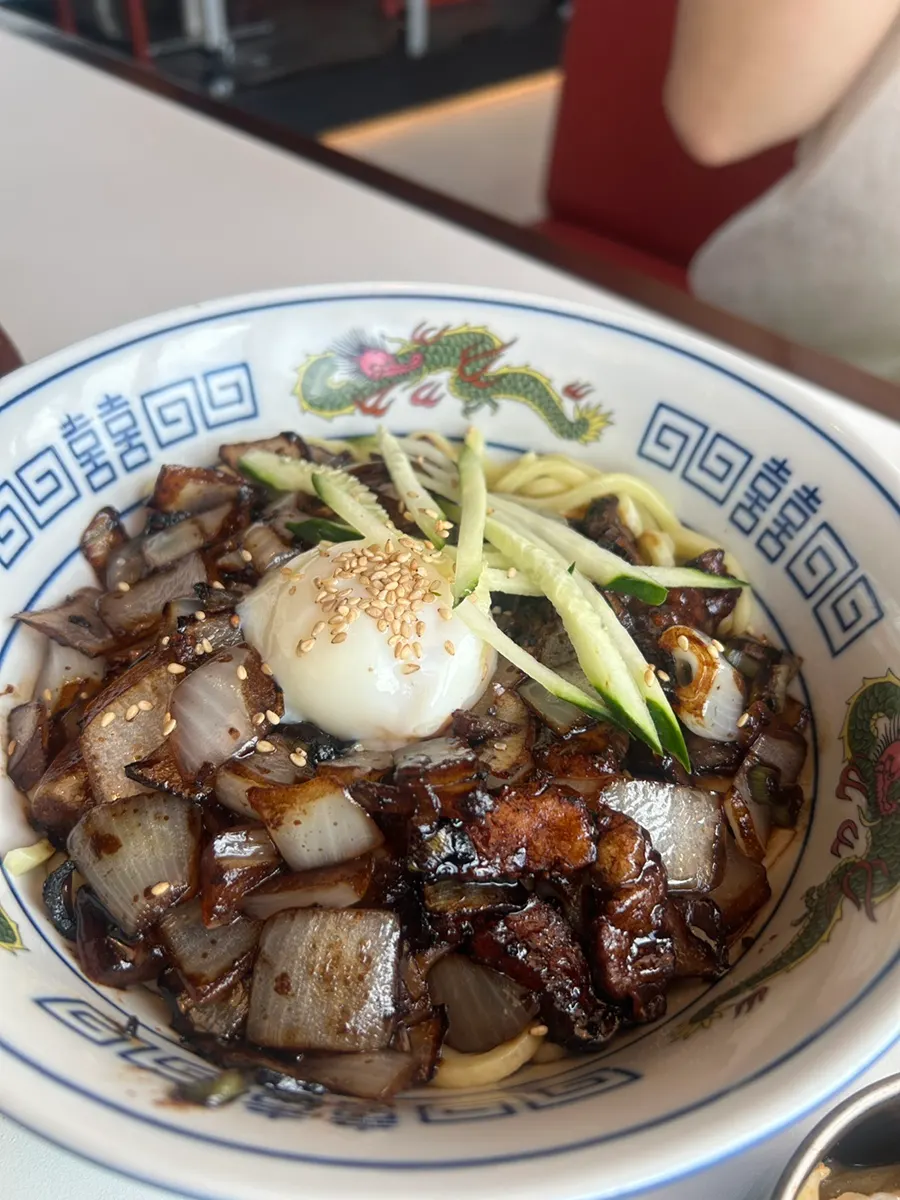 Ganjajang noodles mixed with the burst poached egg
