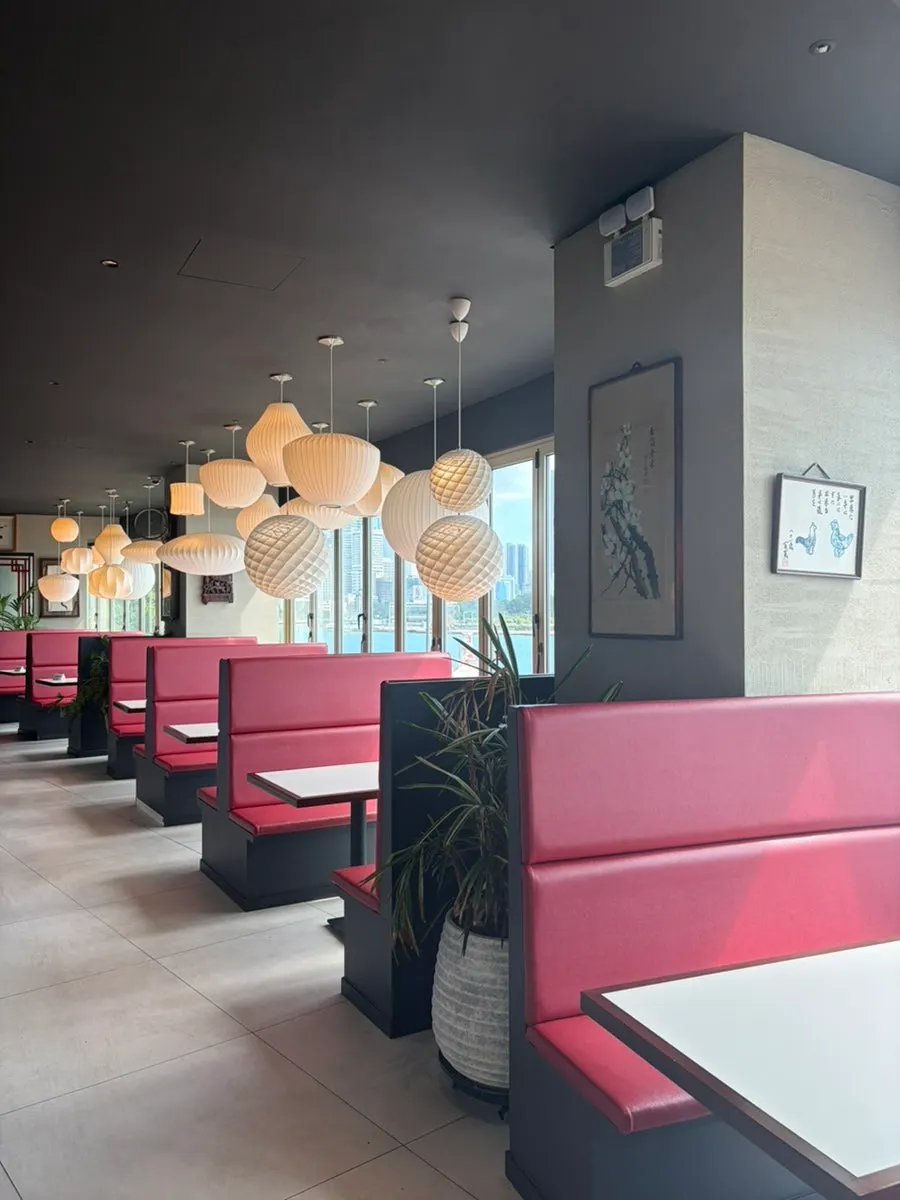 Group seating toward the back of the restaurant with both forest and ocean views