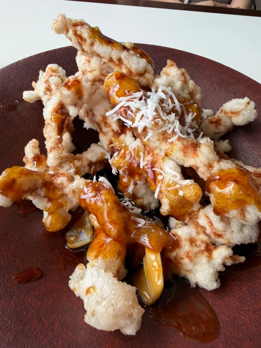 Close-up of tangsuyuk with black vinegar sauce